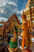 Chiang Mai - Wat Phra That Doi Suthep. The innercourtyard of the temple is filled with Buddha statues and other religious paraphenalia. 